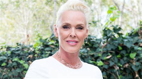 brigitte nielsen sexy|Brigitte Nielsen wows in swimsuit photo as she twins。